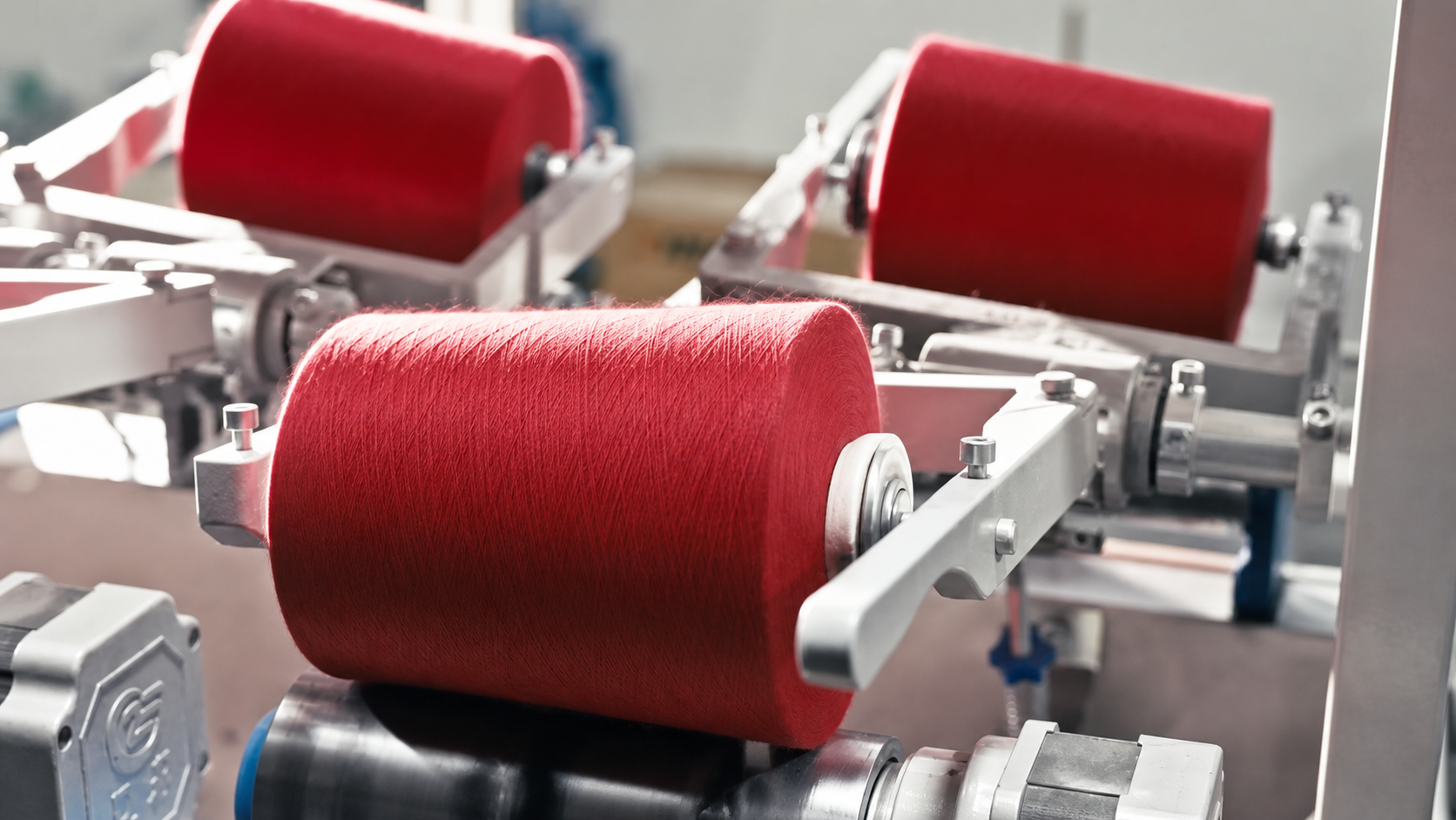 Yarn cones prepared for fine-gauge sweater production