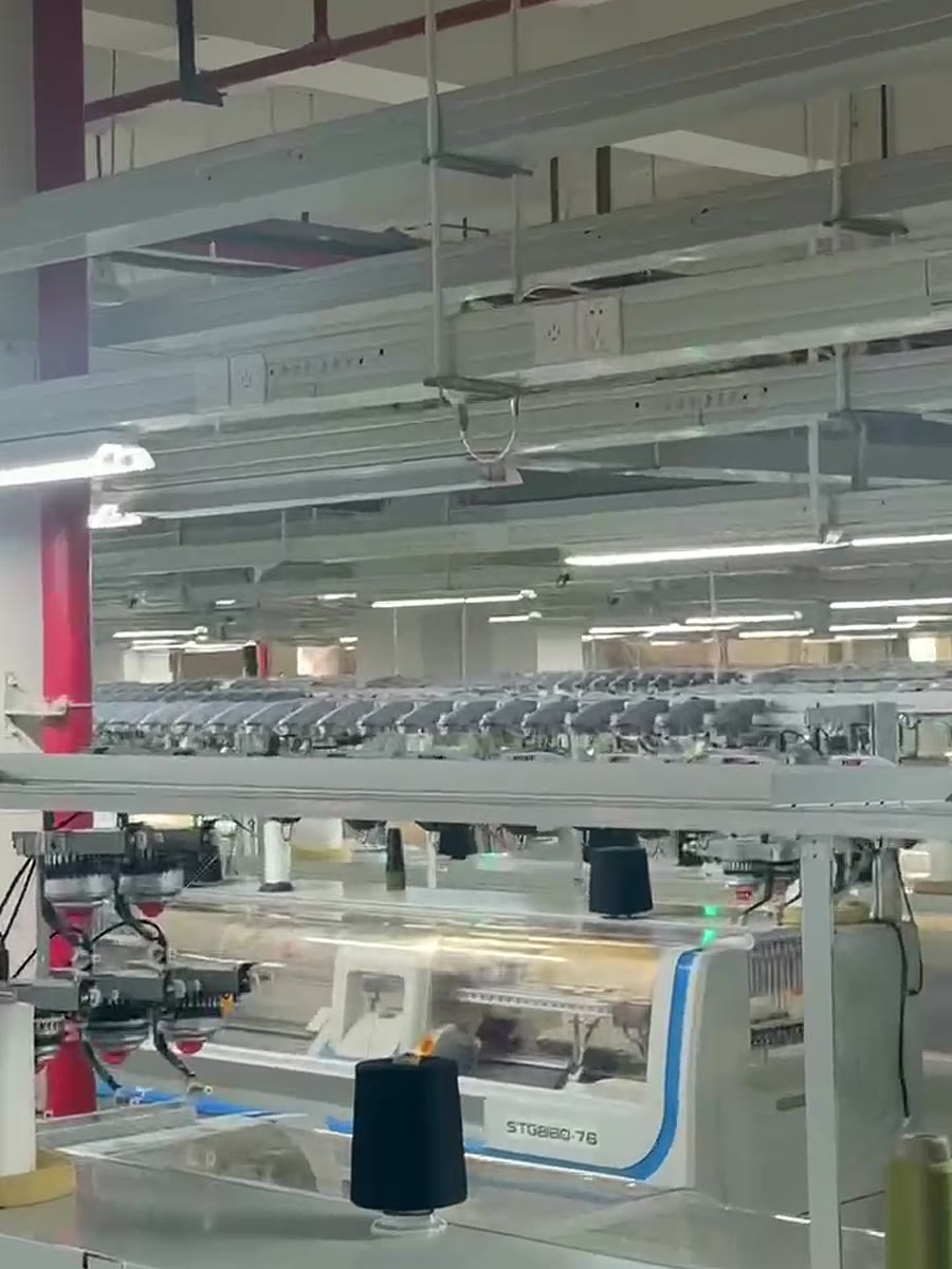Close view of 18G seamless knitting machinery from factory video